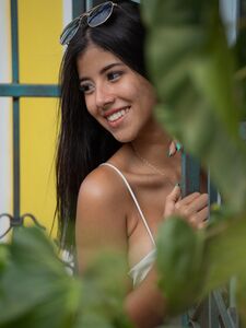 Pretty Latina with a leg tattoo Iris Lucky presents her big tits & masturbates